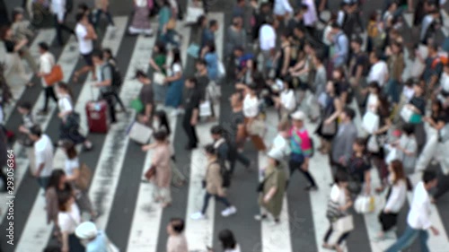 Wallpaper Mural UMEDA, OSAKA, JAPAN - CIRCA SEPTEMBER 2019 : Aerial blurred view of zebra crossing near Osaka train station. Crowd of people at the street. Shot in busy rush hour. Slow motion. Torontodigital.ca