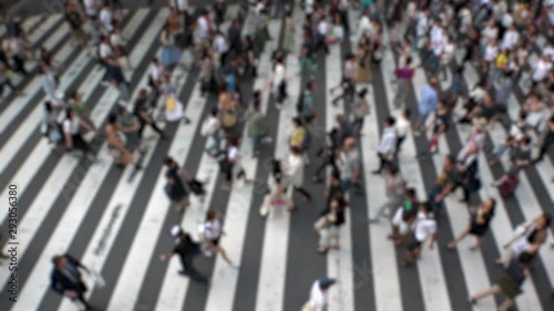 Wallpaper Mural UMEDA, OSAKA, JAPAN - CIRCA SEPTEMBER 2019 : Aerial blurred view of zebra crossing near Osaka train station. Crowd of people at the street. Shot in busy rush hour. Slow motion. Torontodigital.ca