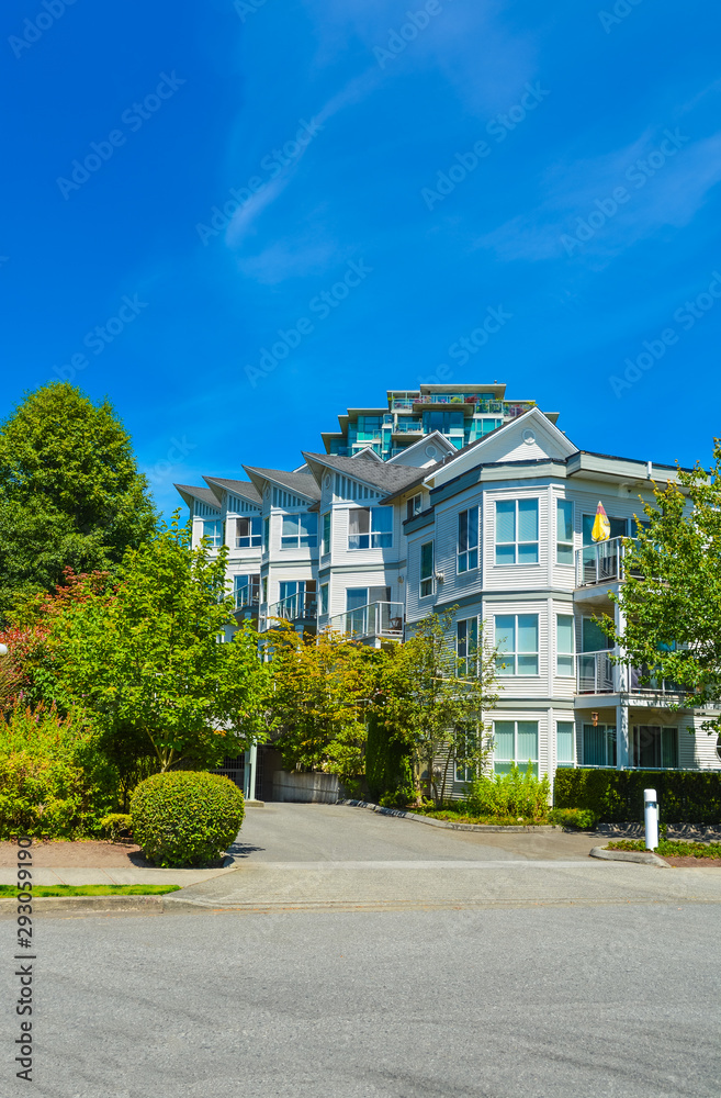 Modern apartment building on bright sunny day in Vancouver, British Columbia