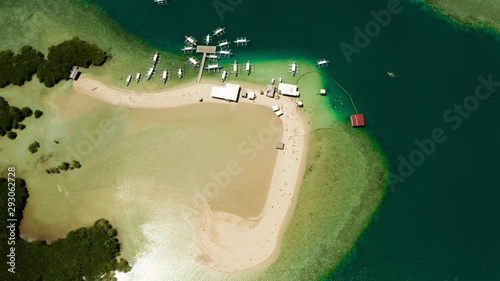 Luli island, Puerto Princesa, Palawan. Island hopping Tour at Honda Bay, Palawan. An island of white sand with mangroves. Atoll with a white island, view from above.
