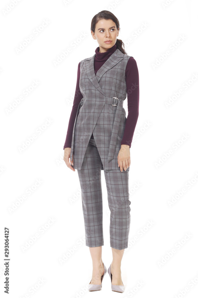 business woman executive posing in formal polka dot official blouse with bow trousers high heels stiletto shoes