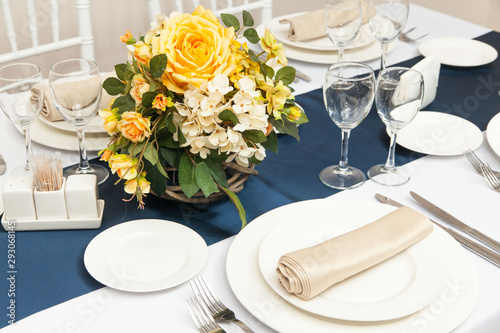 The served table with beautiful setting in restaurant