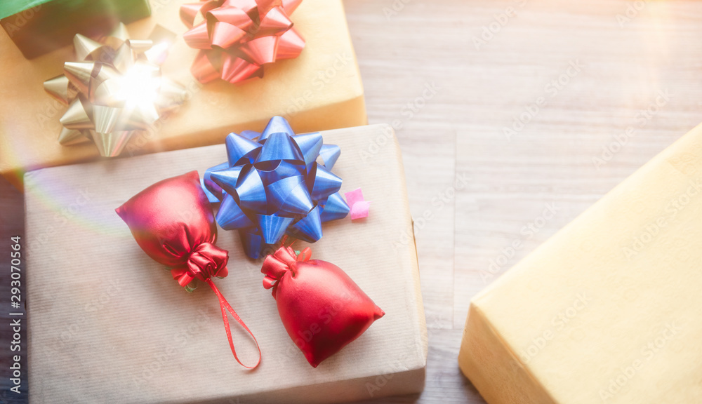 Three Christmas boxes with decoration gift on a floor with glow light. Happy new year and merry x-mas. Three Christmas boxes with decoration gift on a floor with glow light. Happy new year and merry x-mas.