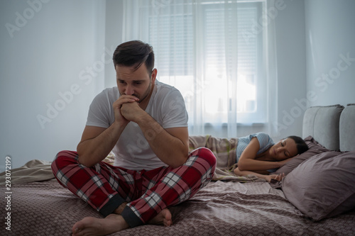 Photos Young man is having trouble with sleep.