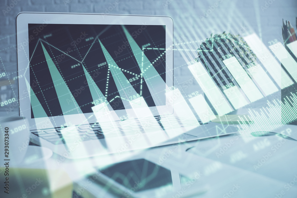 Forex graph hologram on table with computer background. Multi exposure. Concept of financial markets. Forex graph hologram on table with computer background. Multi exposure. Concept of financial markets.