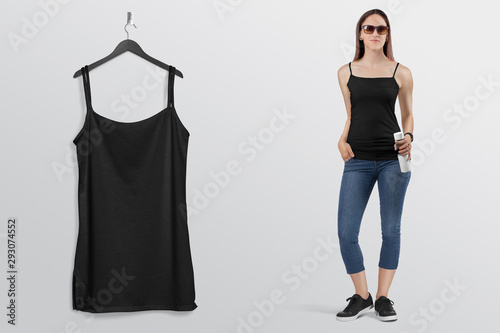 Foto Hanging plain black camisole shirt on wall