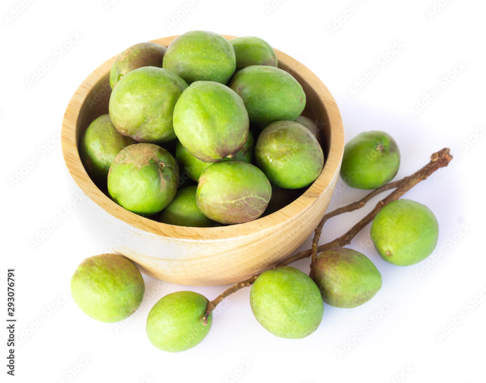 Chebulic Myrobalans in wood bowl isolated on white background, herb and medical Chebulic Myrobalans in wood bowl isolated on white background, herb and medical