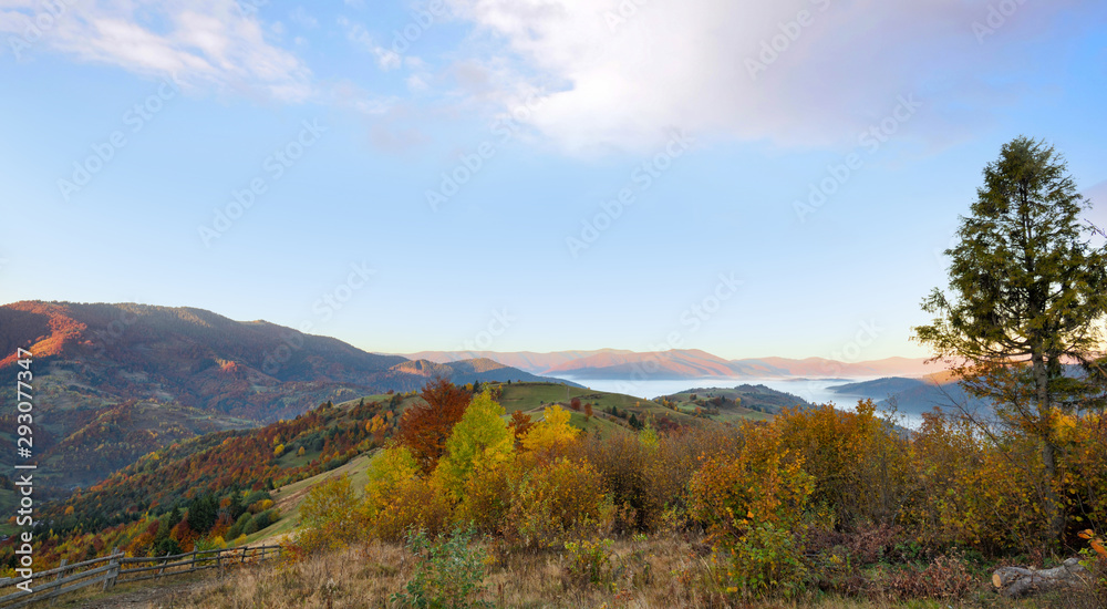 Beautiful autumn mountain landscape in the morning light with fog and bright hills. Carpathian, Ukraine, Europe. Beautiful autumn mountain landscape in the morning light with fog and bright hills. Carpathian, Ukraine, Europe.