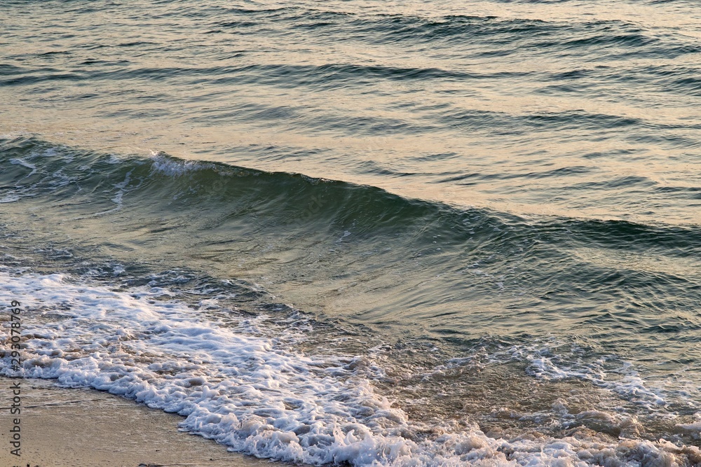 Background texture of a calm deep ocean with ripples on the surface of the sea water ,warm tone color Background texture of a calm deep ocean with ripples on the surface of the sea water ,warm tone color