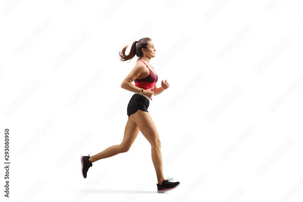 Young female athlete in sportswear jogging