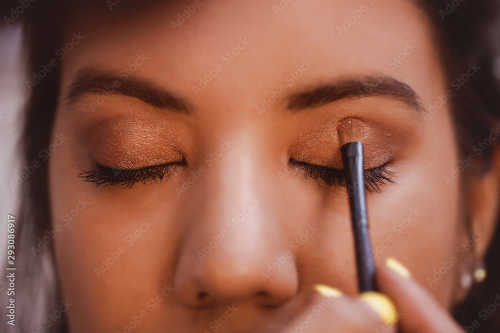 Makeup Artist applies Eye Shadow