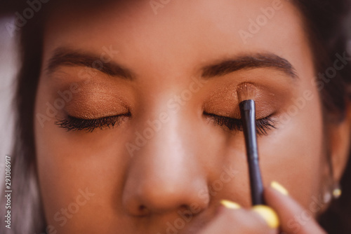 Makeup Artist applies Eye Shadow