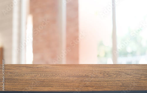 Empty dark wooden table in front of abstract blurred bokeh background of restaurant . can be used for display or montage your products.Mock up for space.