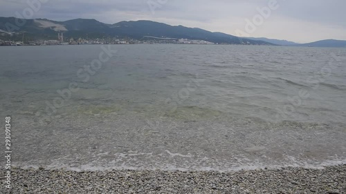 Novorossiysk seaport, tsemess bay, sea coast and waves beat against the shore.