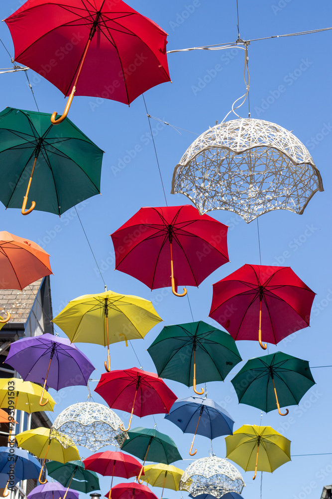 Obraz premium Umbrellas against blue sky 