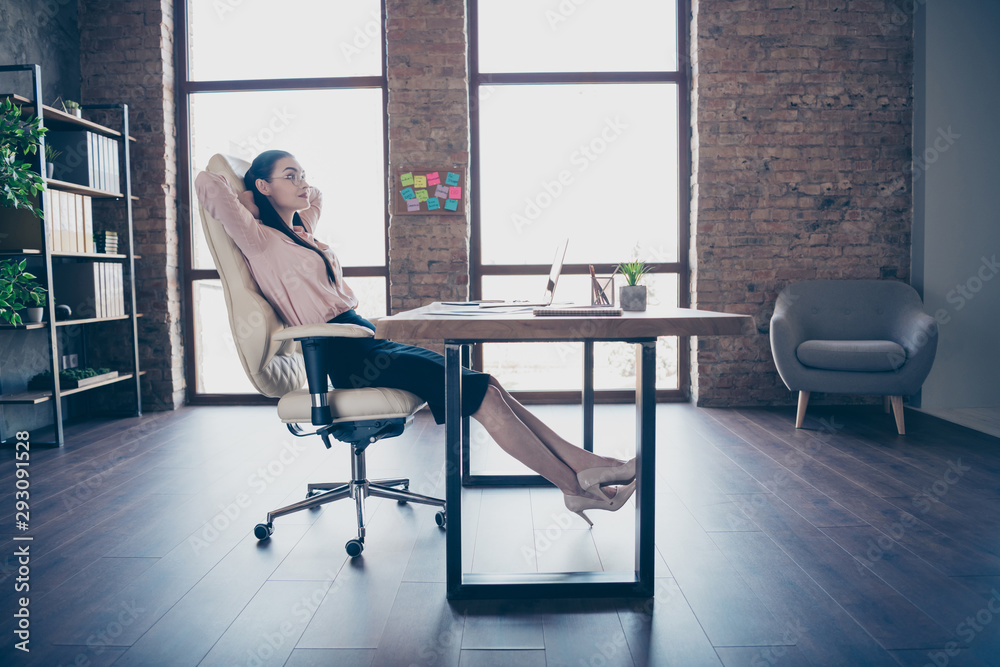 Full length body size photo of resting relaxing girl employed just for work in transnational company wearing formally heels shoes sitting at desktop
