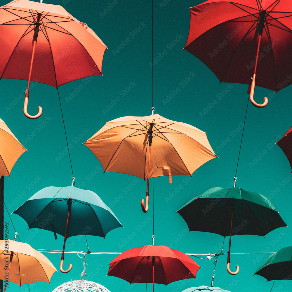 Umbrellas against blue sky 