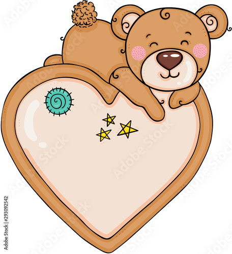 Teddy bear sleeping on top of big heart