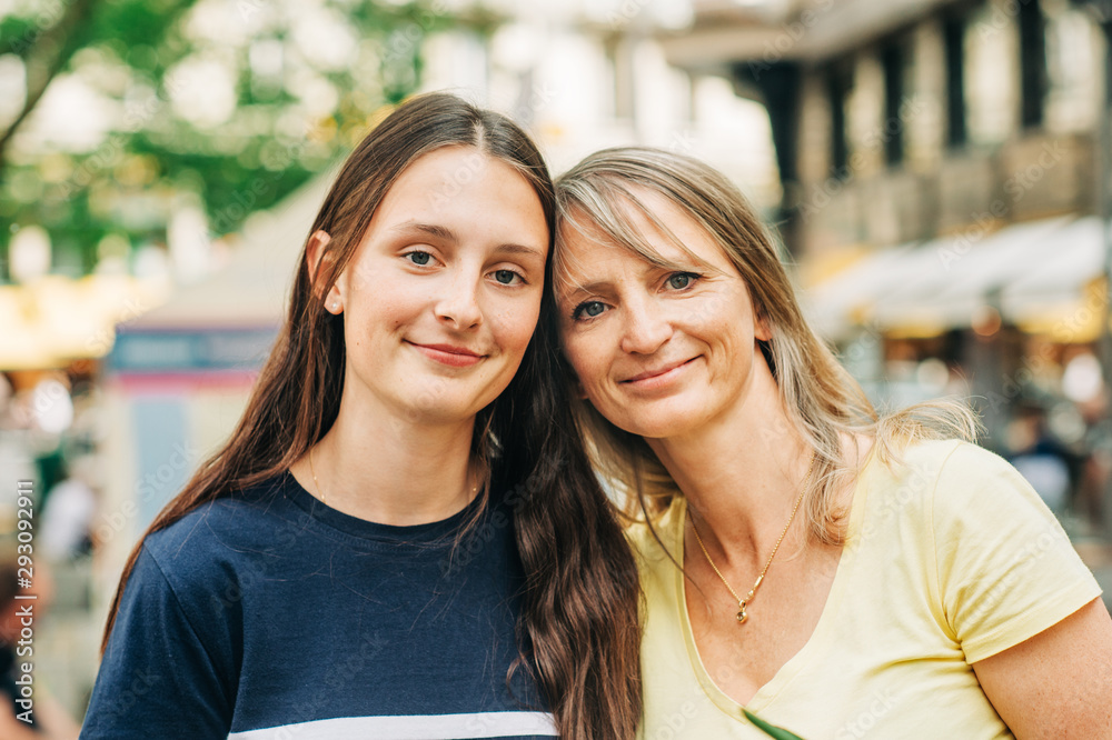 Outdoor portrait of young teenage girl with her mom Outdoor portrait of young teenage girl with her mom