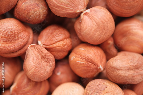 Hazelnut Background. Heap of peeled hazelnuts. Peeled hazelnut closeup. photo