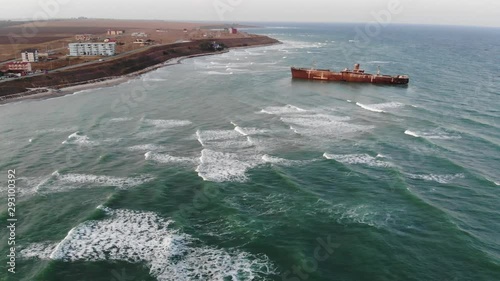 Aerial view of the coastline and Evanghelia shipwreck stranded on the Black Sea at Costinesti photo