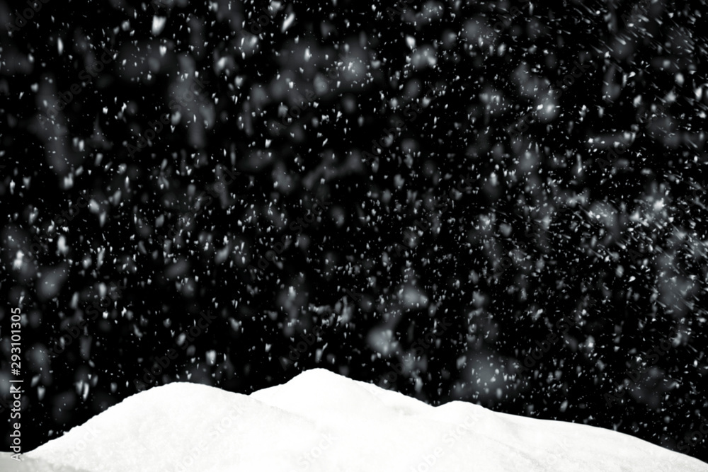 Winter snow flakes with free space for your product. Black background to mount your picture through the screen Winter snow flakes with free space for your product. Black background to mount your picture through the screen