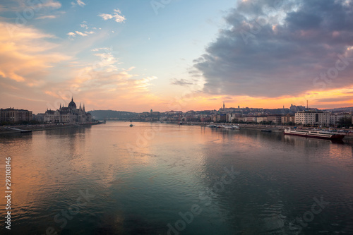 Incredible Evening View of Budapest parliament and Danube river at sunset, Hungary. Wonderful Cityscape with Colorful sky. © k_samurkas