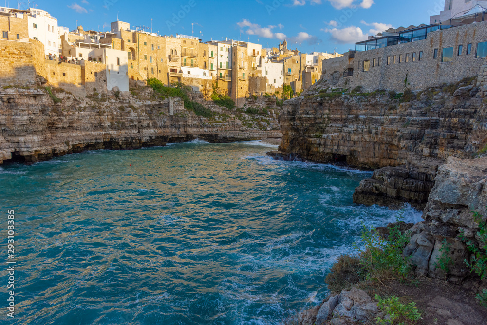 Italy, Polignano a mare, view of the houses overlooking the sea