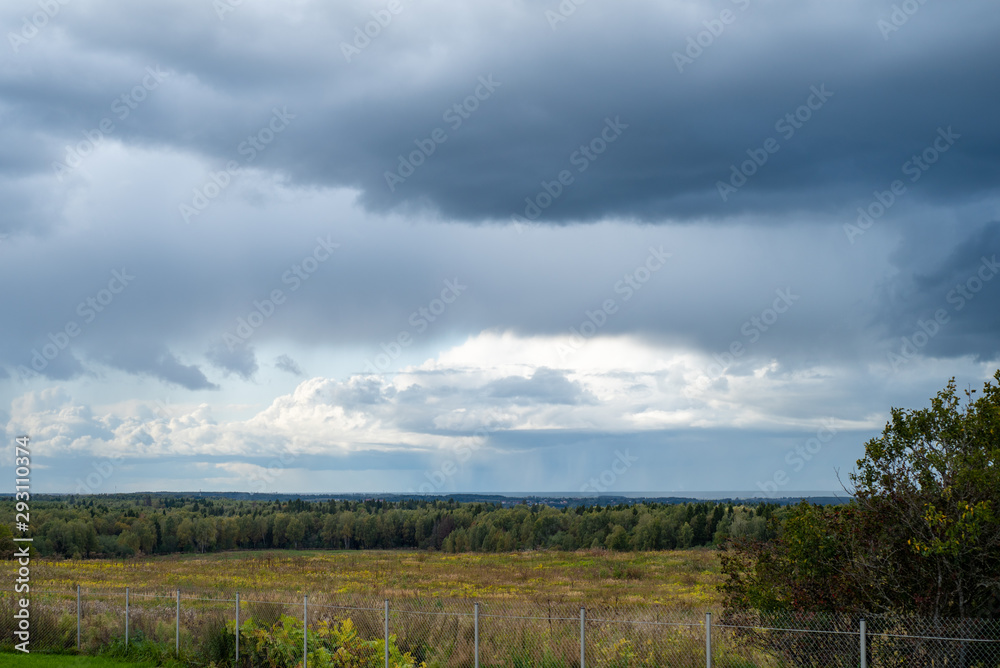 Gloomy landscape on the background of storm clouds