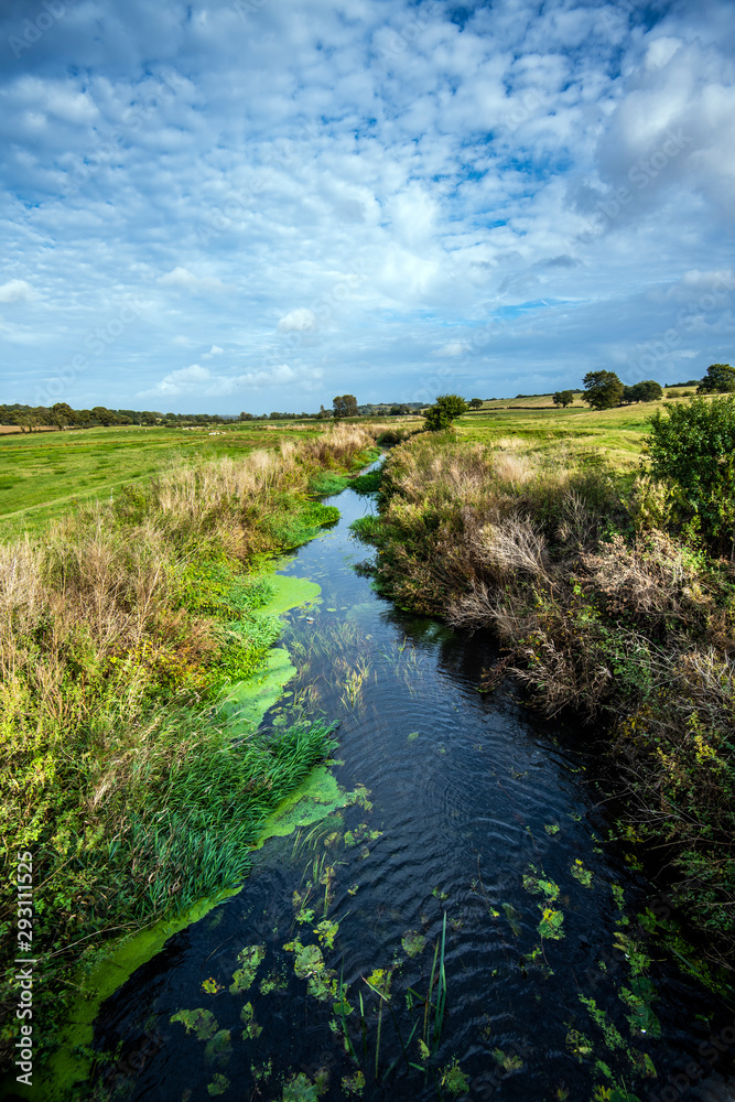 View of the River Brede as it enters Romney Marsh at Brede Bridge, East Sussex, England