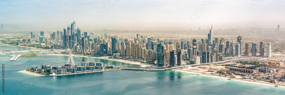 Panoramic aerial view of Dubai Marina skyline with Dubai Eye ferris wheel, United Arab Emirates, UAE