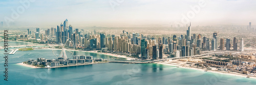 Panoramic aerial view of Dubai Marina skyline with Dubai Eye ferris wheel, United Arab Emirates photo