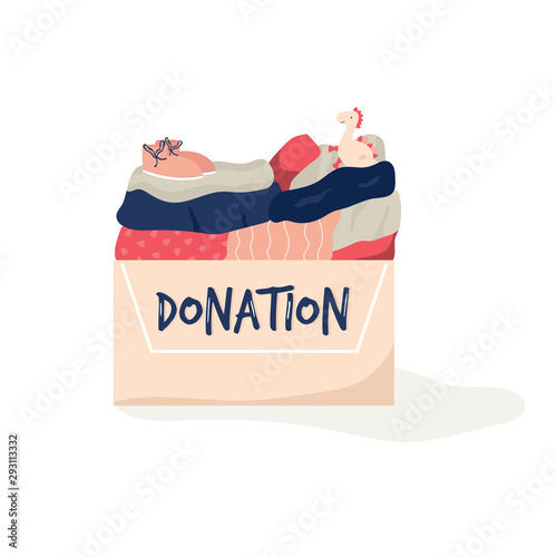Cardboard box for donations full of clothing, toys