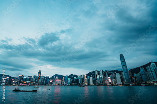 Hong Kong Victoria Harbor night view with junk ship on foreground © YiuCheung