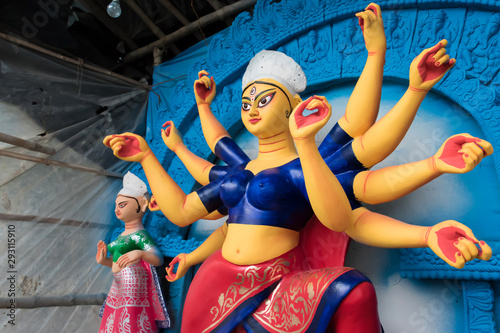 Clay idol of Goddess Devi Durga is in preparation for the upcoming Durga Puja festival at a pottery studio in Kolkata, West Bengal, India.
