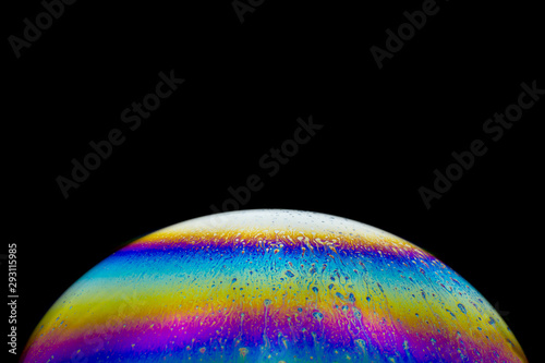 Colorful fantasy planet - soap-bubble abstract on black background
