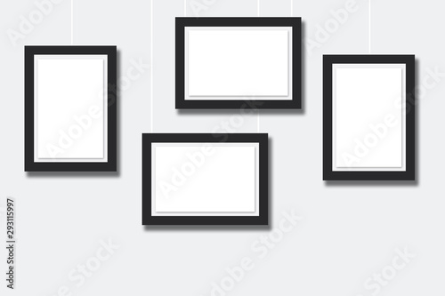 set of blank frames on wall