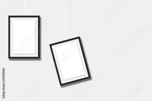 black blank photo frames on white wall background