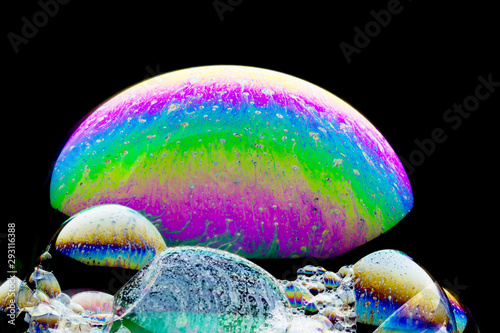 Colorful planets - beautiful  soap-bubble abstract on black background