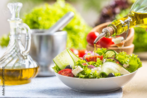 olive; oil; pouring; salad; vegetable; food; fresh; healthy; meal; leaf; tomato; vegetarian; lettuce; dinner; cucumber; nutrition; snack; appetizer; dish; closeup; delicious; green; bowl; plate; lunch