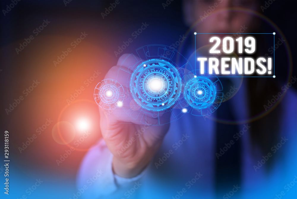 Text sign showing 2019 Trends. Business photo showcasing general direction in which something is developing or changing Woman wear formal work suit presenting presentation using smart device