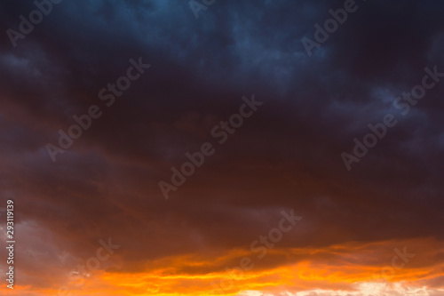 Storm clouds at sunset in bright colors