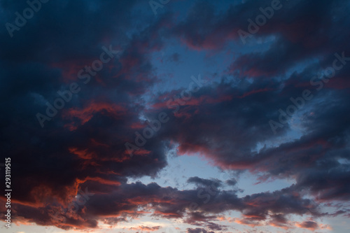 Storm clouds at sunset in bright colors