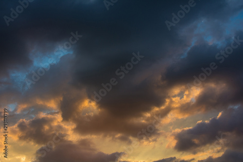 Fototapeta Naklejka Na Ścianę i Meble -  Storm clouds at sunset in bright colors