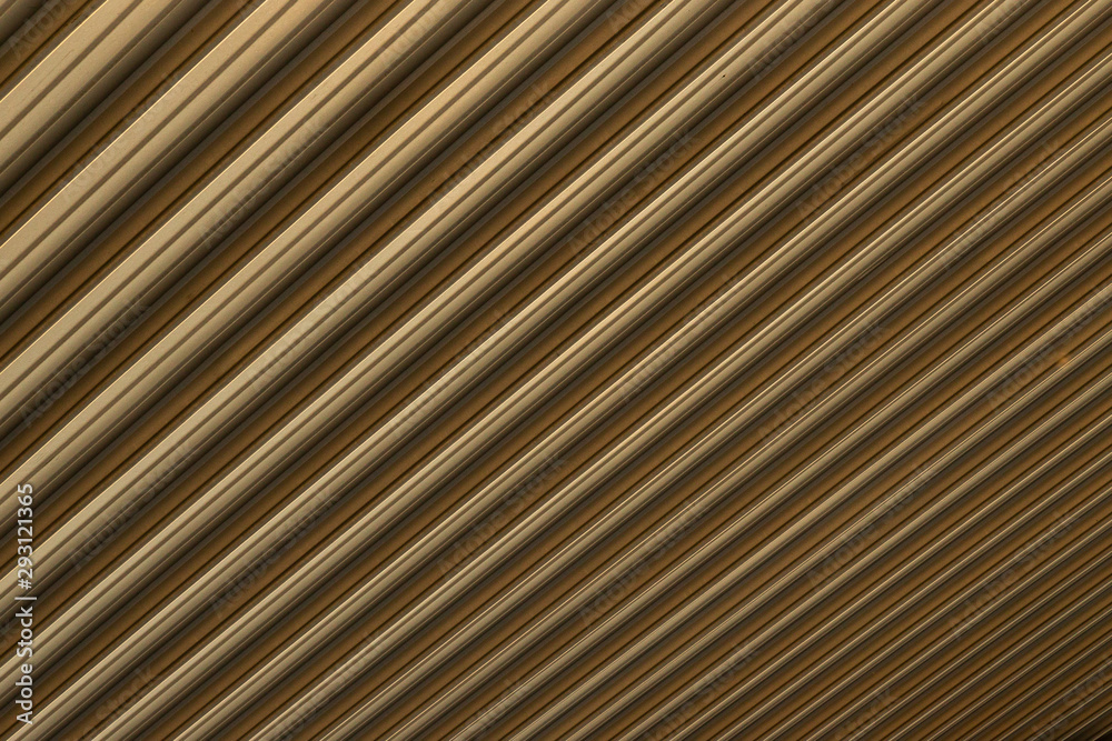 Close-up of beige-brown corrugated surface causing optical illusion Close-up of beige-brown corrugated surface causing optical illusion