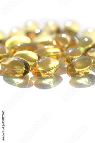 Capsules with fish oil, vitamins A and D. Vertical image