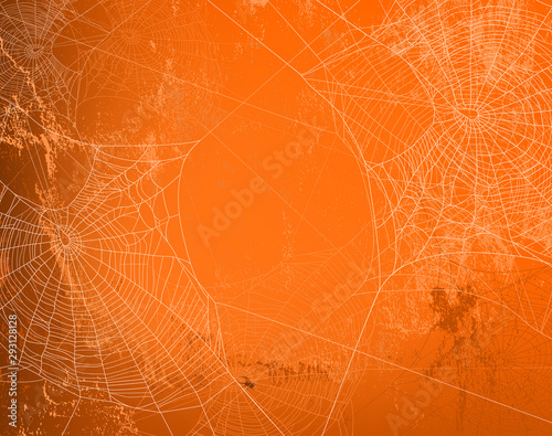 shabby orange wall covered with spooky spider web - halloween theme bright copy space background photo