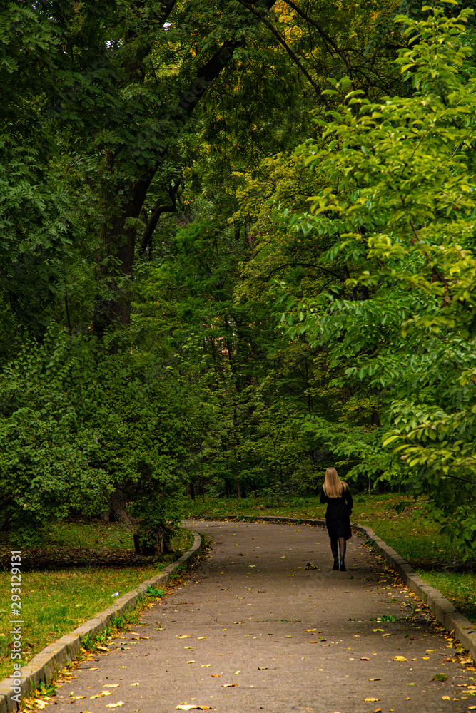 young woman walking in the park