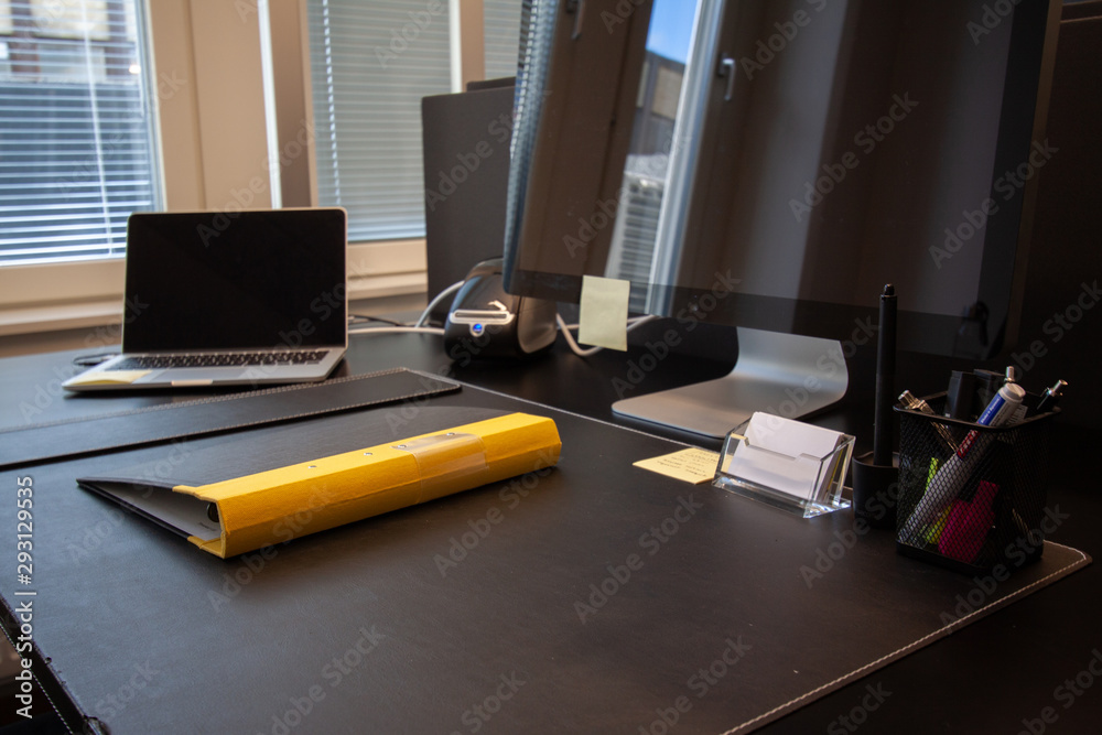 Naklejka premium Office desk yellow folder. Laptop with external screen.
