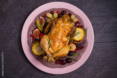 Whole roast chicken or turkey with fruits, vegetables and berries. Overhead, horizontal